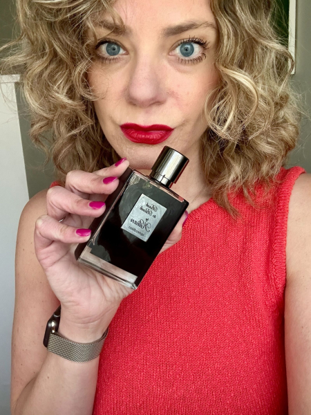 A selfie of Allure contributor Kara Nesvig holding the Kilian Paris Back to Black Eau de Parfum